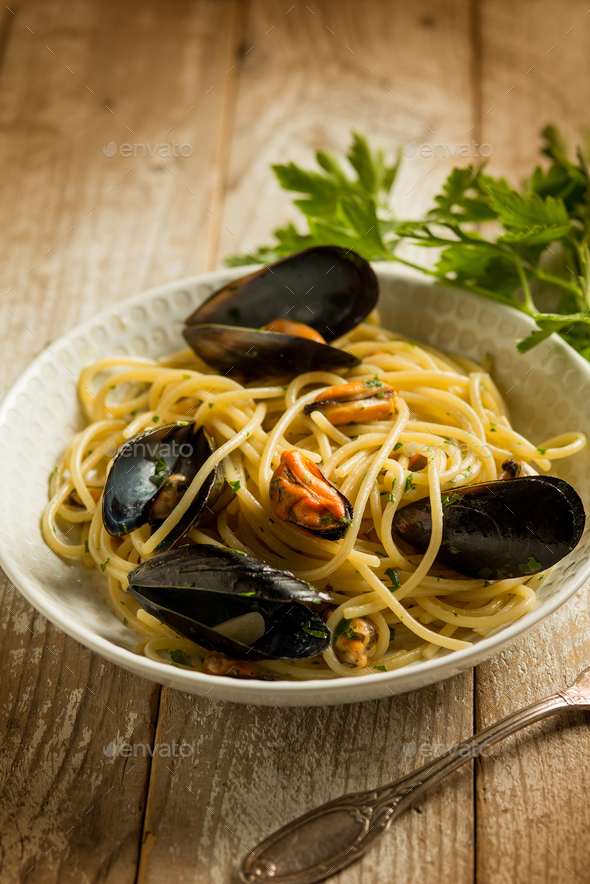 pasta with mussels garlic and parsley, traditional italian recipe Stock